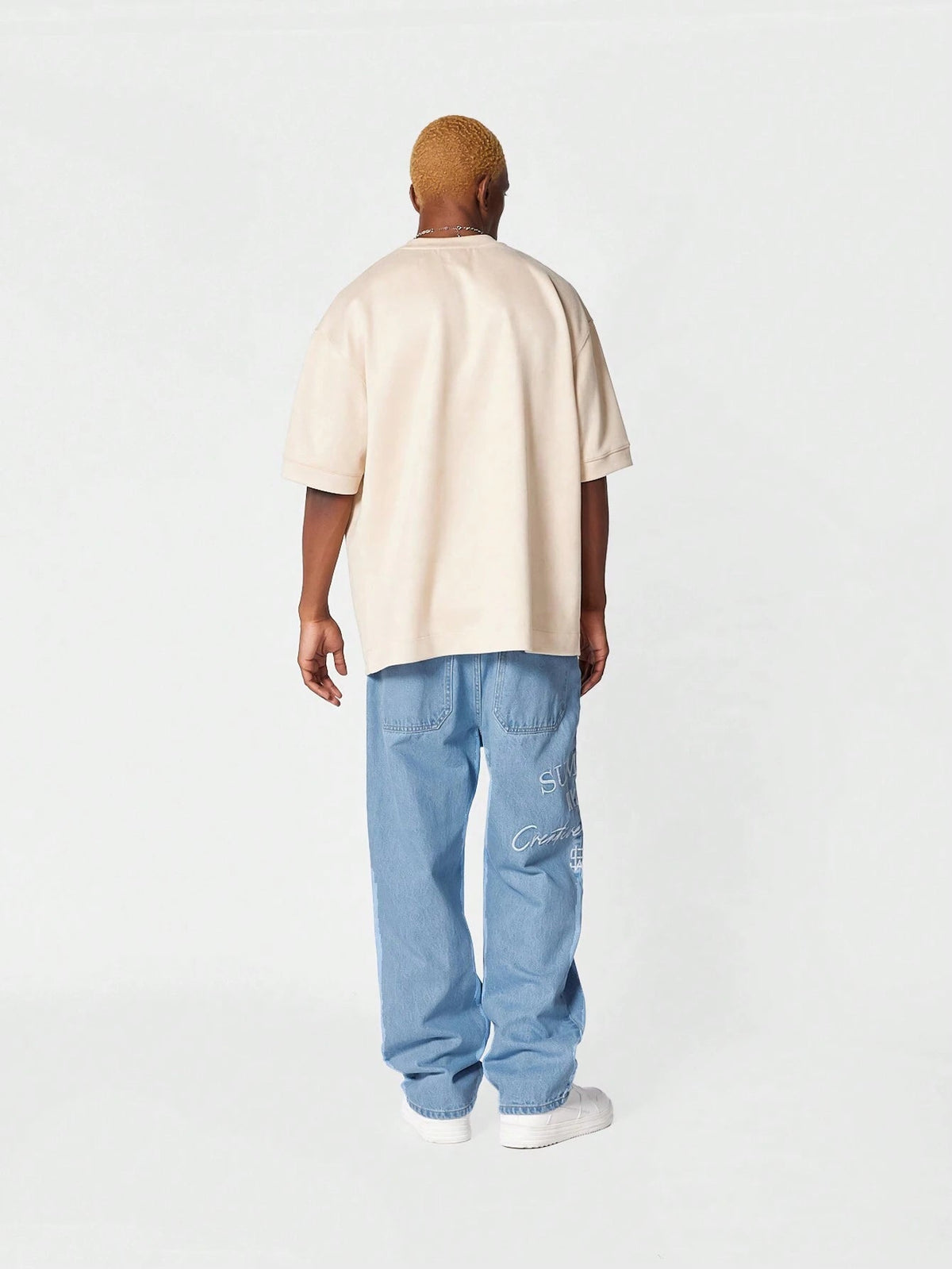 Calça Pavtros Denim reta com bordado