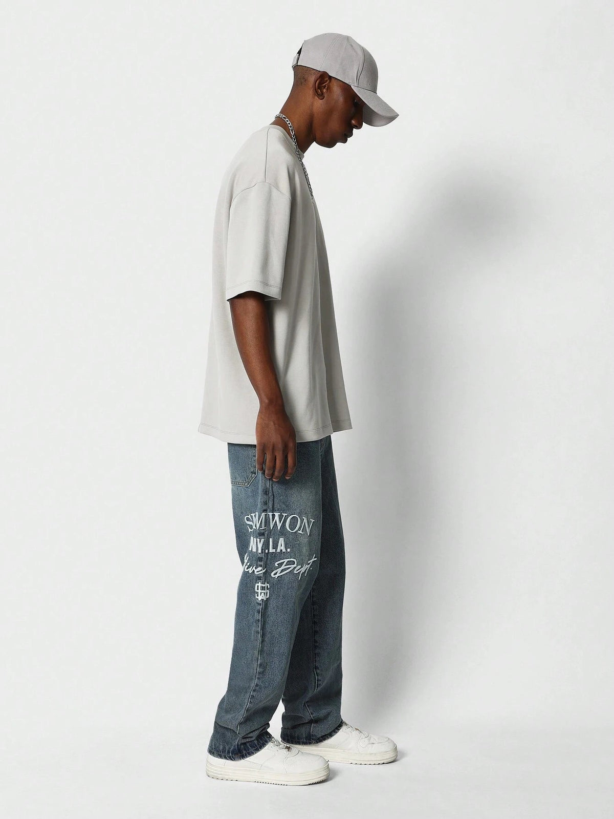 Calça Pavtros Denim reta com bordado
