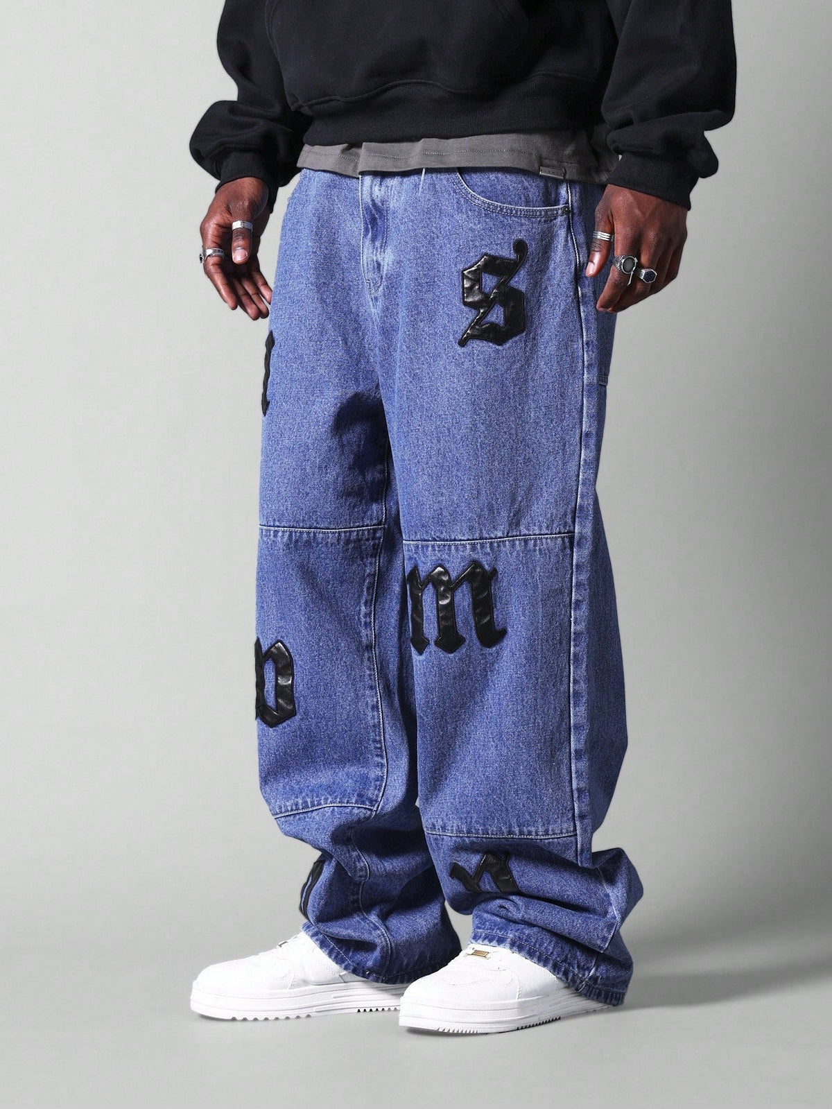 Calça Pavtros Jeans Folgada Com Distintivos
